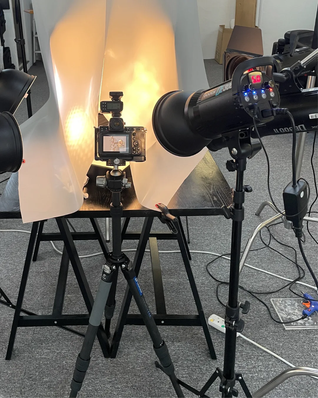 Studio lighting and camera setup for a jewelry product photoshoot